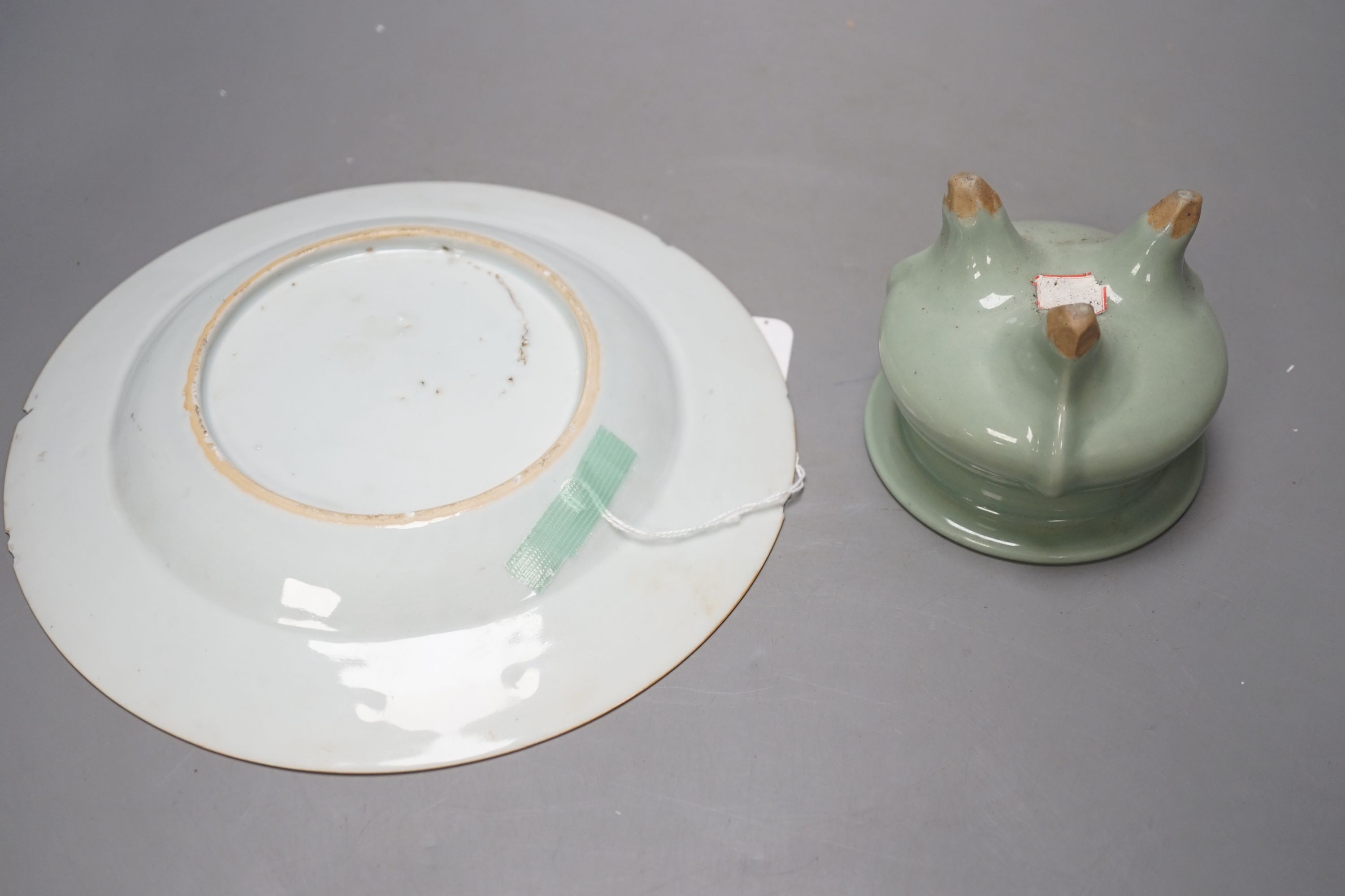 A Chinese Imari plate, Kangxi period and a Chinese celadon ground tripod censer, plate diameter 22cm